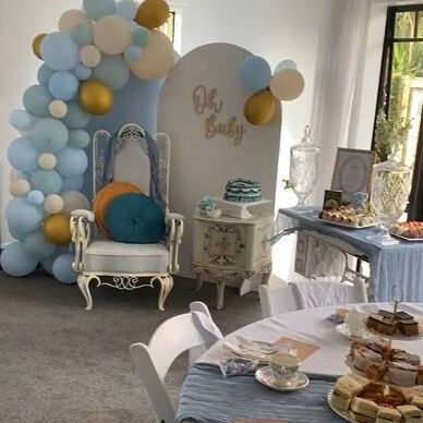 Blue and white balloons at a vintage high tea for a boy baby shower
