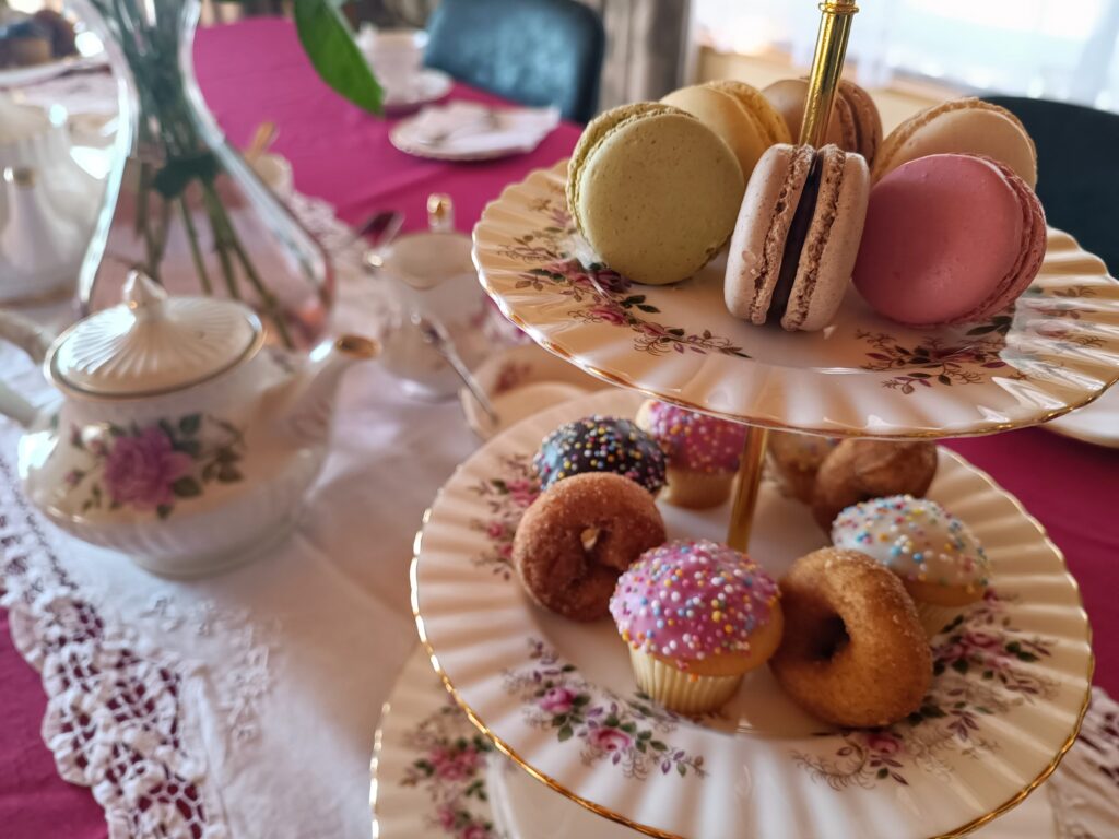 vintage cake stand with macarons, cup cakes and doughnuts